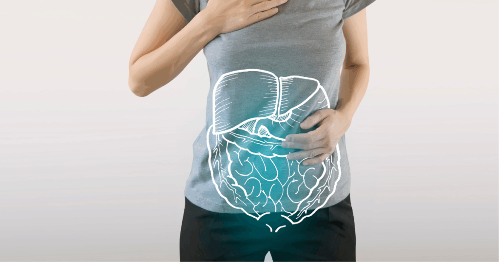Woman touching stomach with digestive system overlay, representing hydration importance during Semaglutide and Tirzepatide weight loss treatment